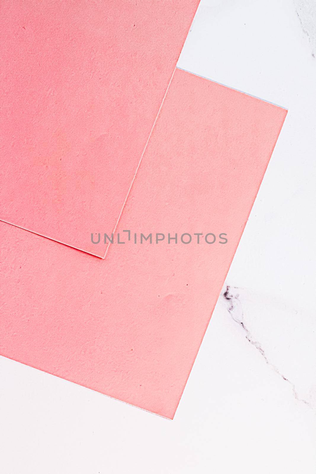 Pink A4 papers on white marble background as office stationery flatlay, luxury branding flat lay and brand identity design for mockups