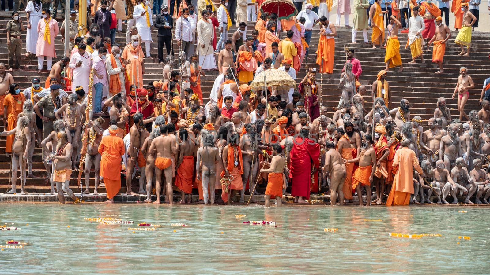 Haridwar, Uttarakhand India April 06, 2021. A Dip of Spirituality and faith, Maha Kumbh 2021. Morning Time dip, Indian saints batting in Ganges of Ganga River and Worshipping their God. High-quality