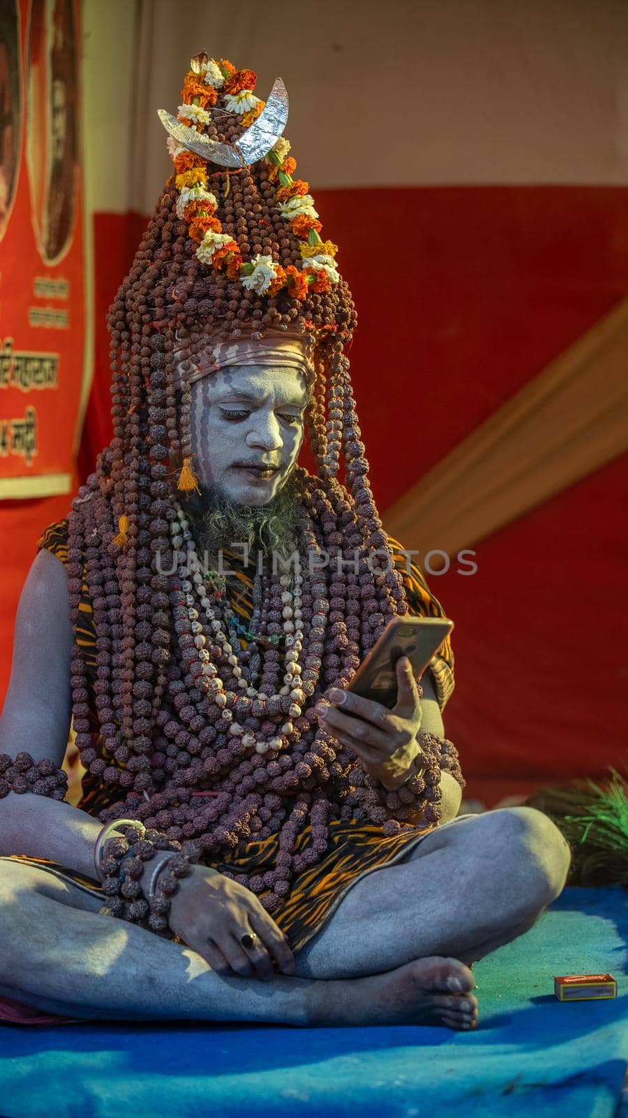 Haridwar, Uttarakhand, India April 12, 2021. Indian Saints in their traditional way of Yog Mudra, meditating. Sitting in silence as part of the initiation of new sadhus during Kumbha Mela. The Naga Sadhus.