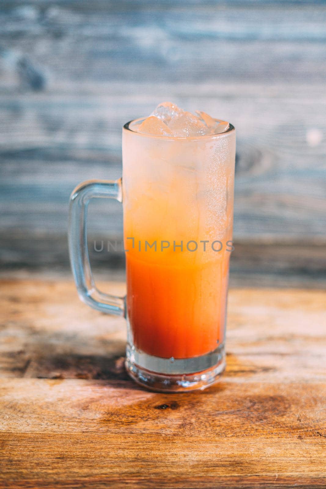 A glass of tequila sunrise drink