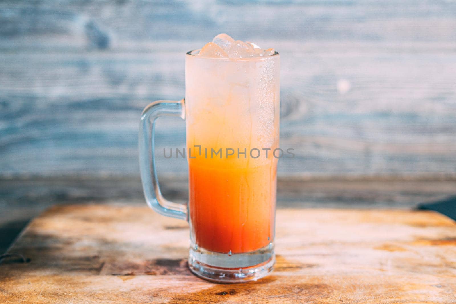 A glass of tequila sunrise drink