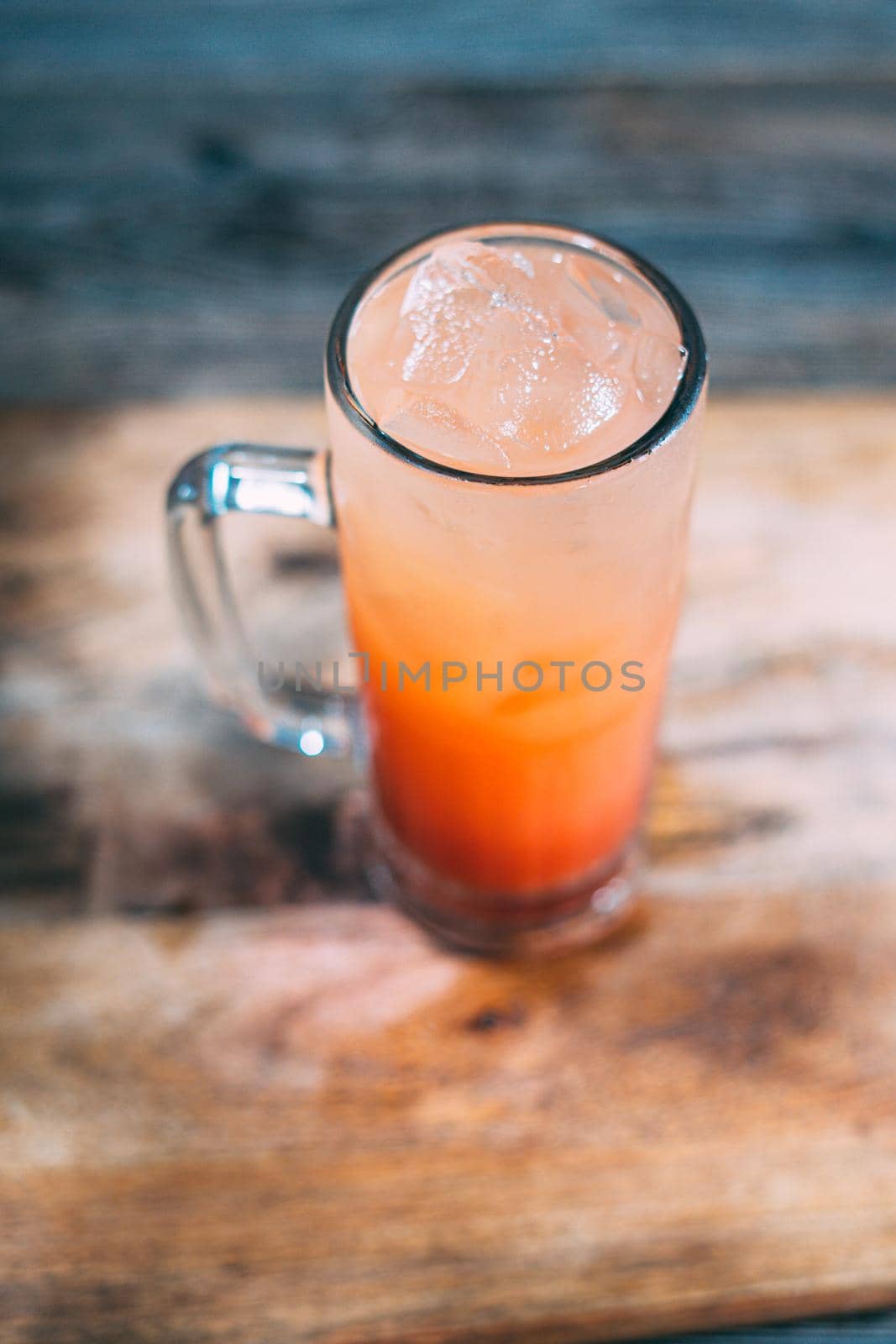A glass of tequila sunrise drink