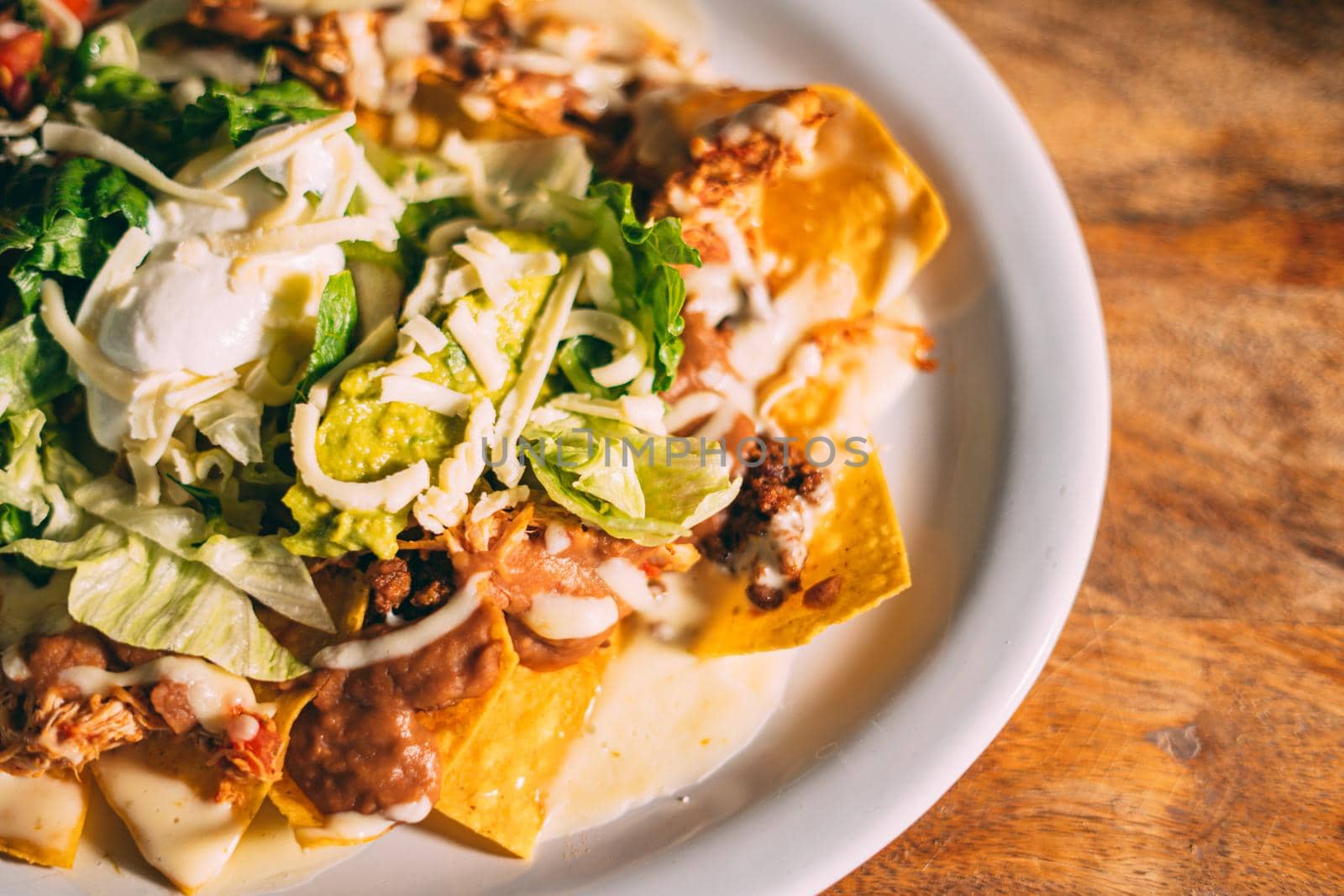 A plate of creamy nachos snack