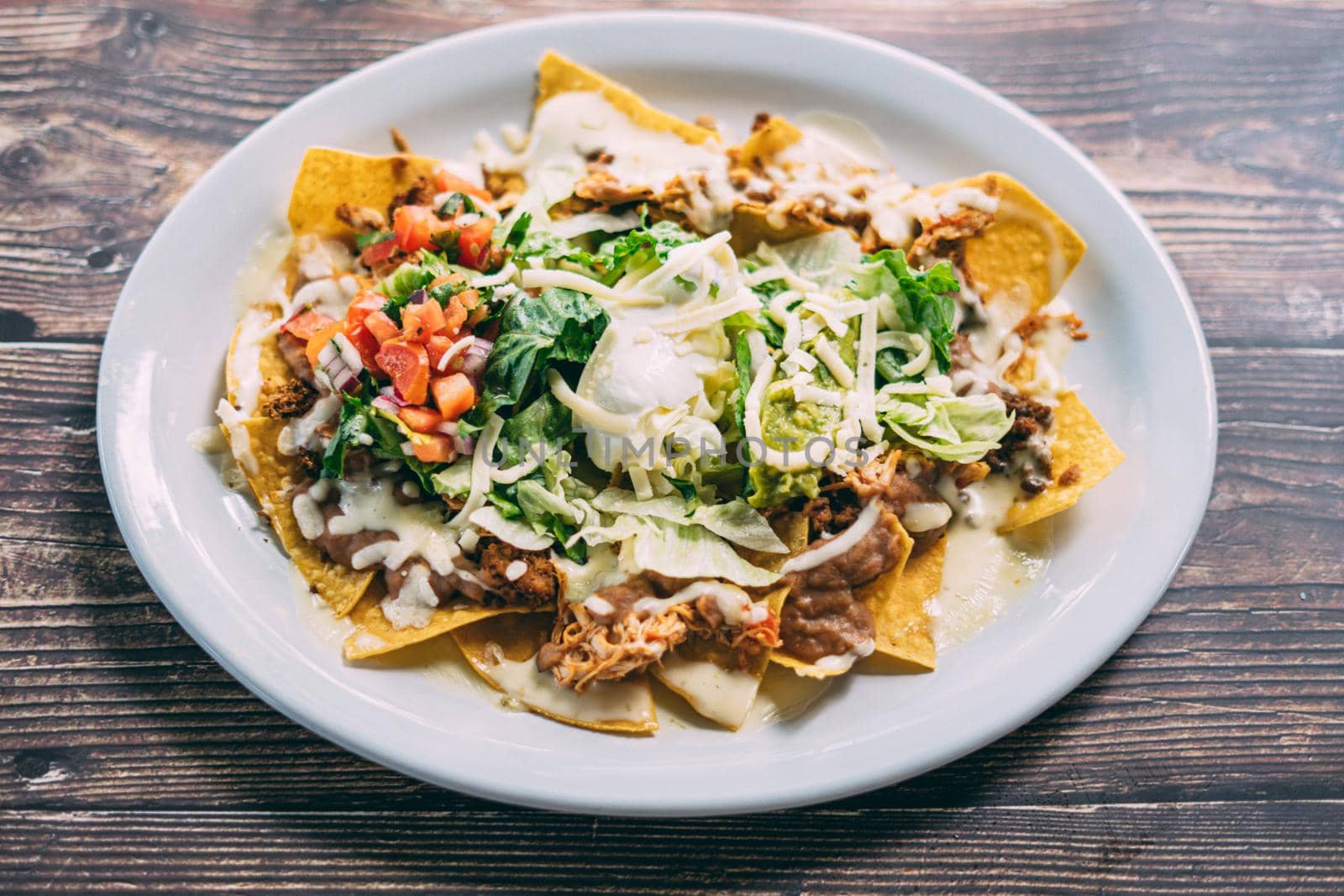 A plate of creamy nachos snack