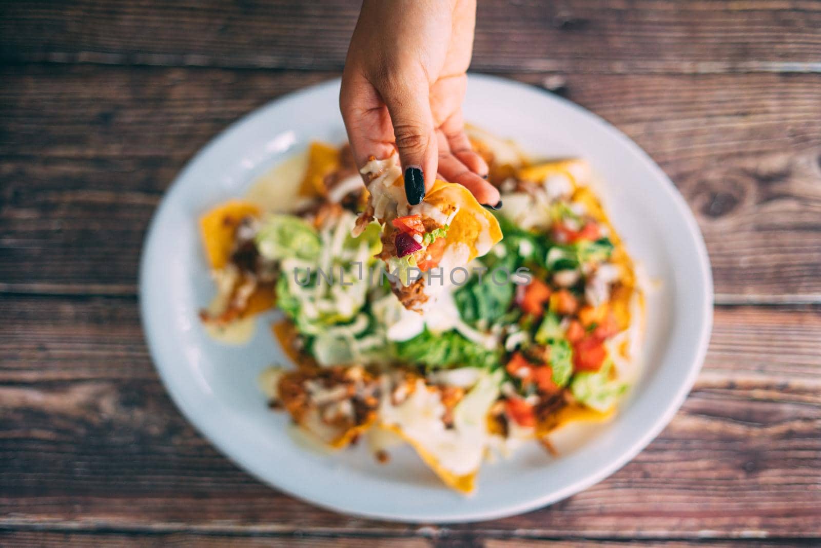 A plate of creamy nachos snack