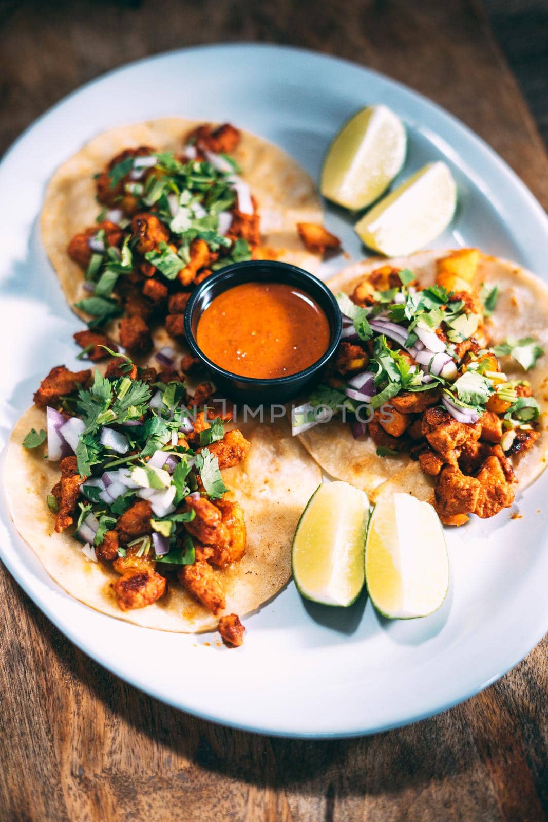 A plate of tacos and tortilla snacks