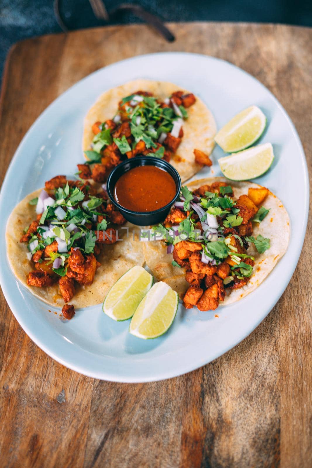 A plate of tacos and tortilla snacks