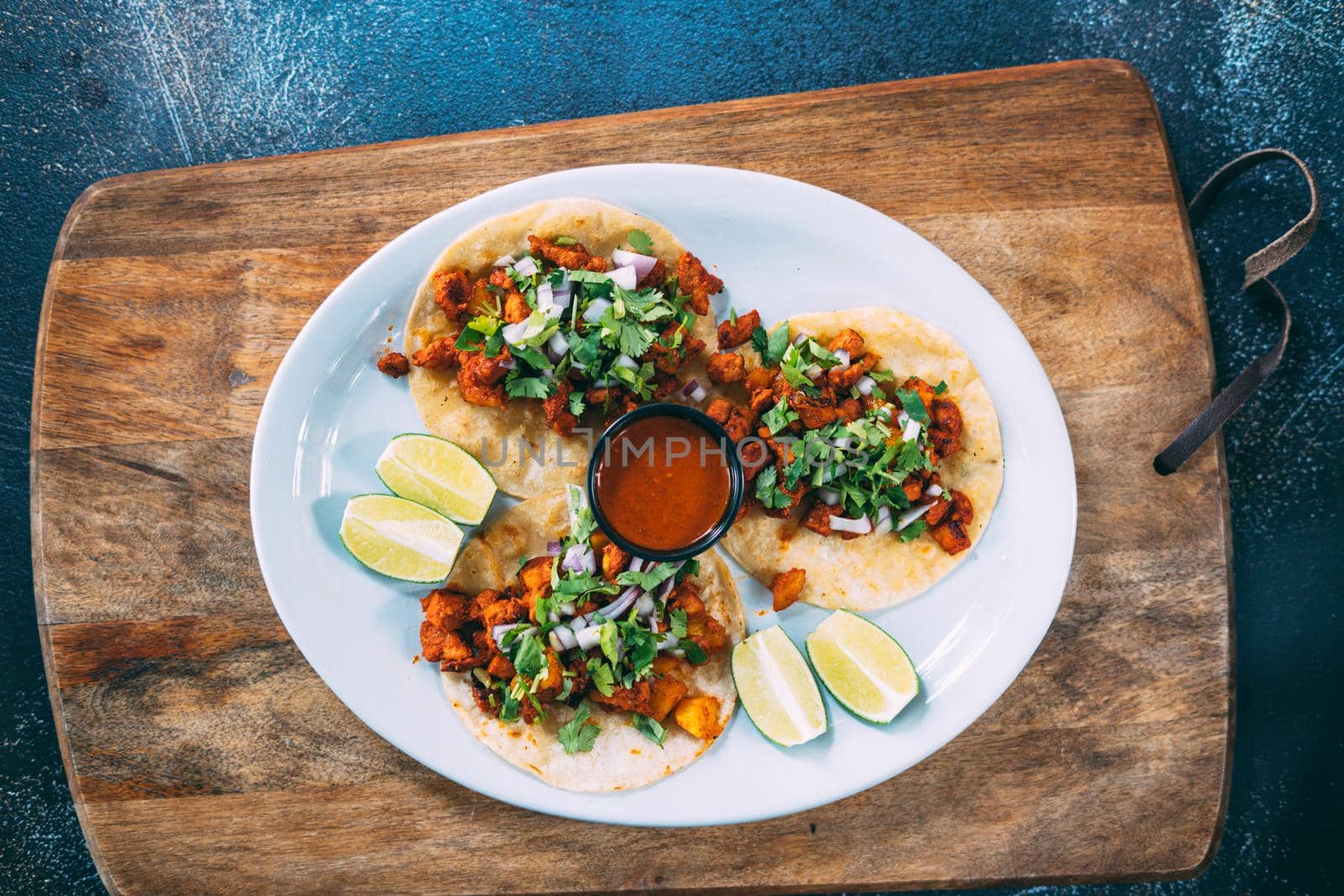 A plate of tacos and tortilla snacks