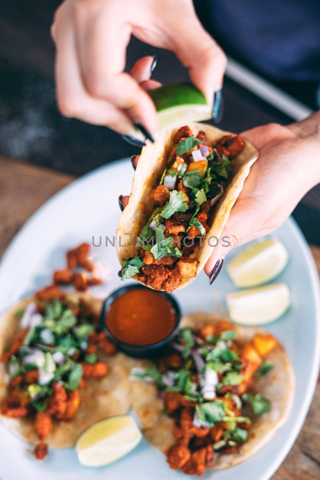 A plate of tacos and tortilla snacks