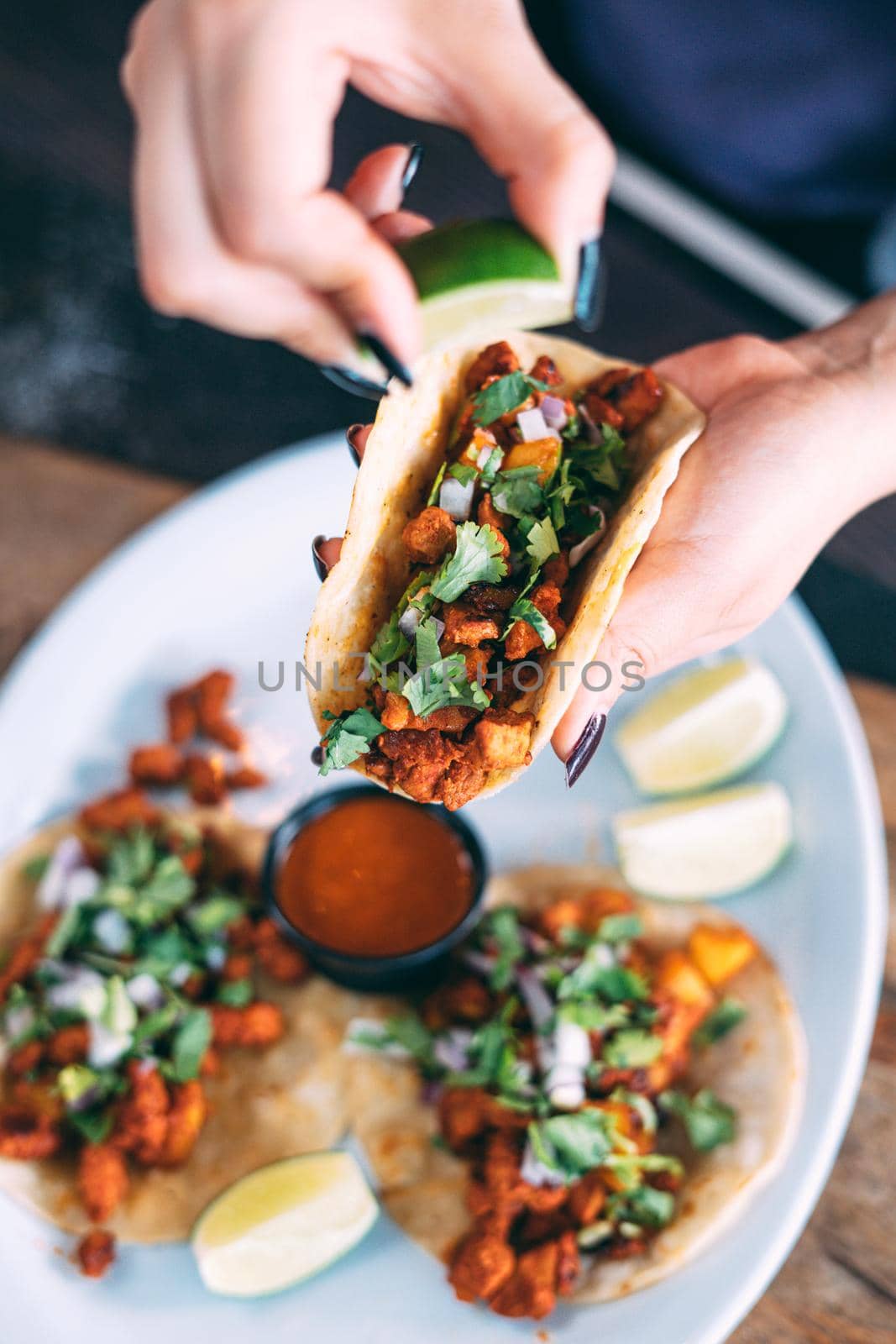 A plate of tacos and tortilla snacks