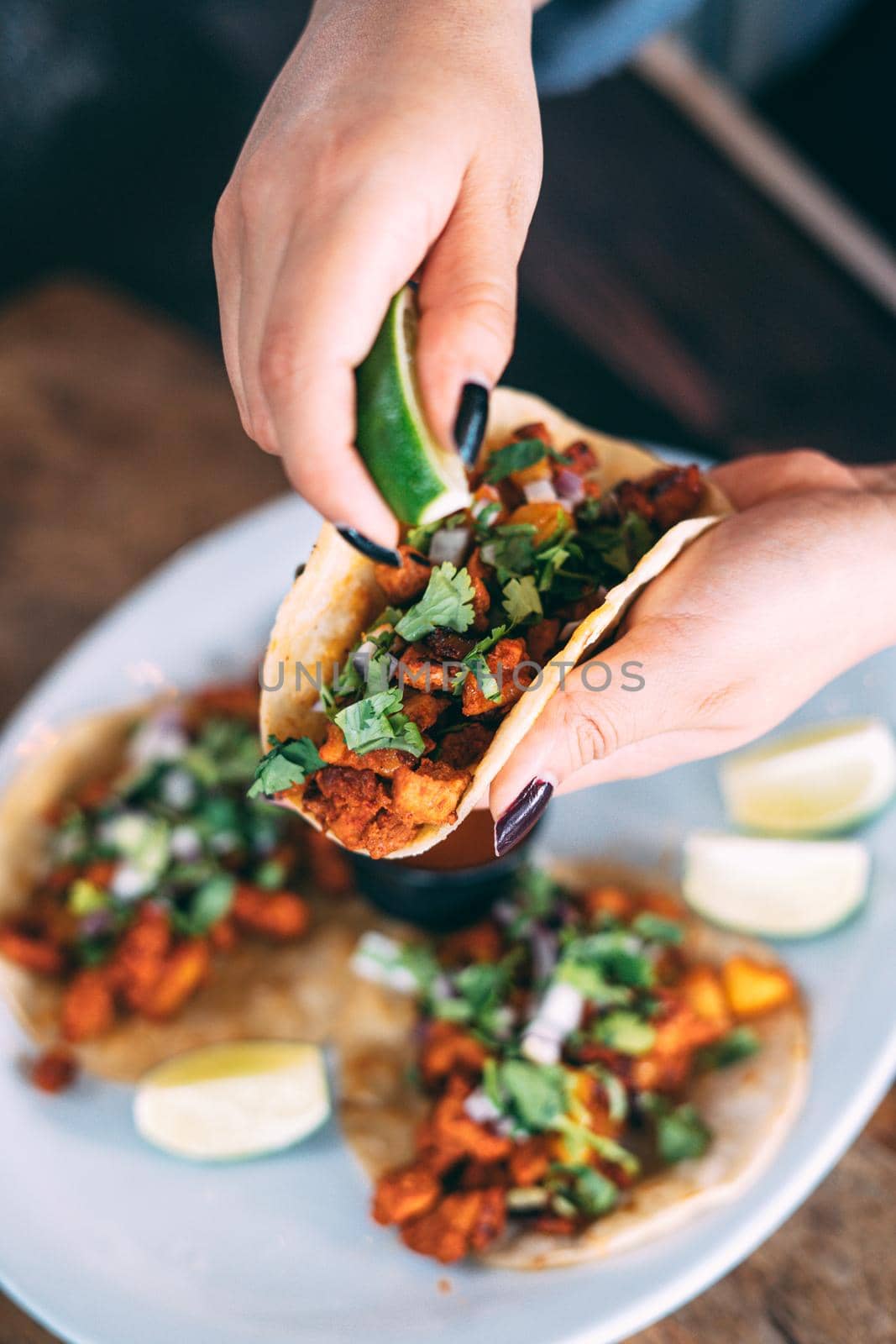 A plate of tacos and tortilla snacks