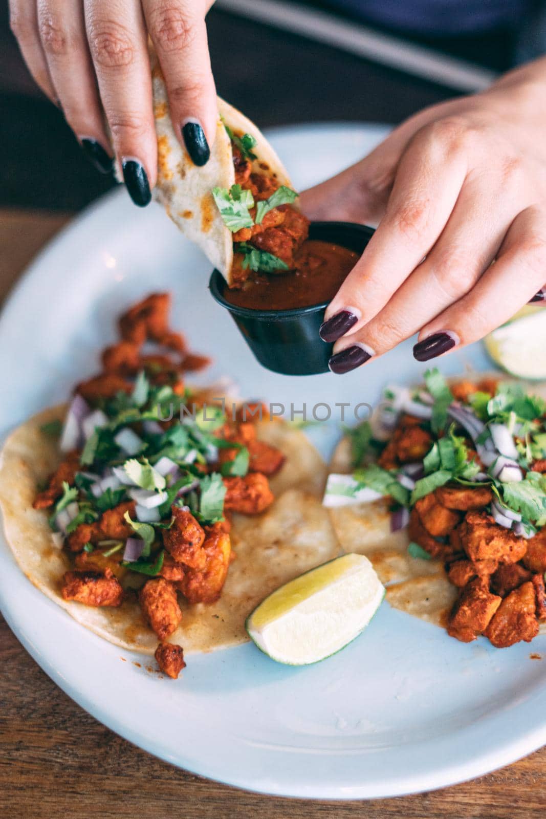 A plate of tacos and tortilla snacks