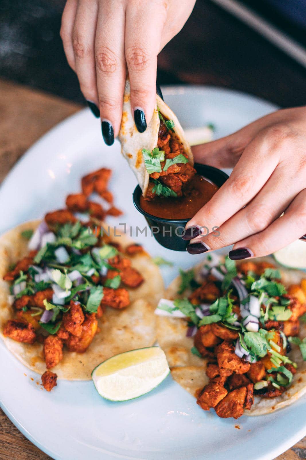 A plate of tacos and tortilla snacks