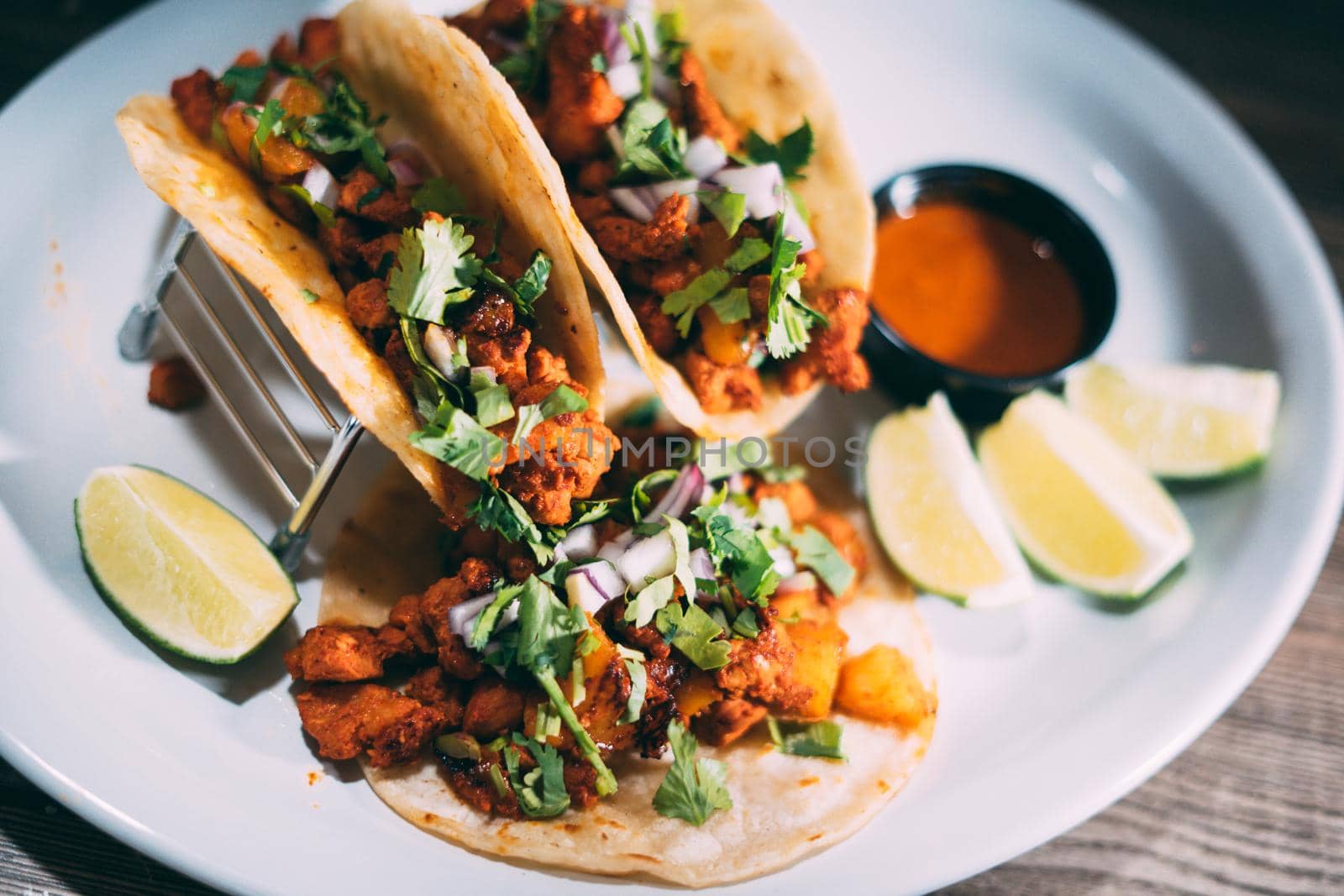 A plate of tacos and tortilla snacks