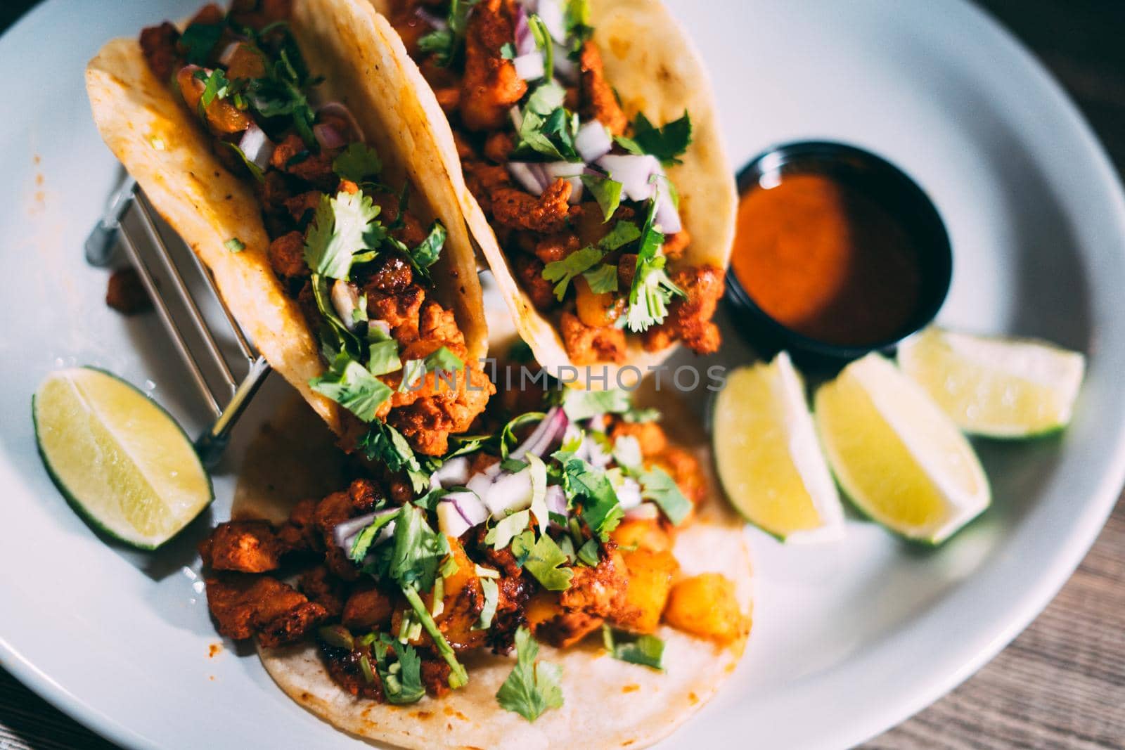 A plate of tacos and tortilla snacks