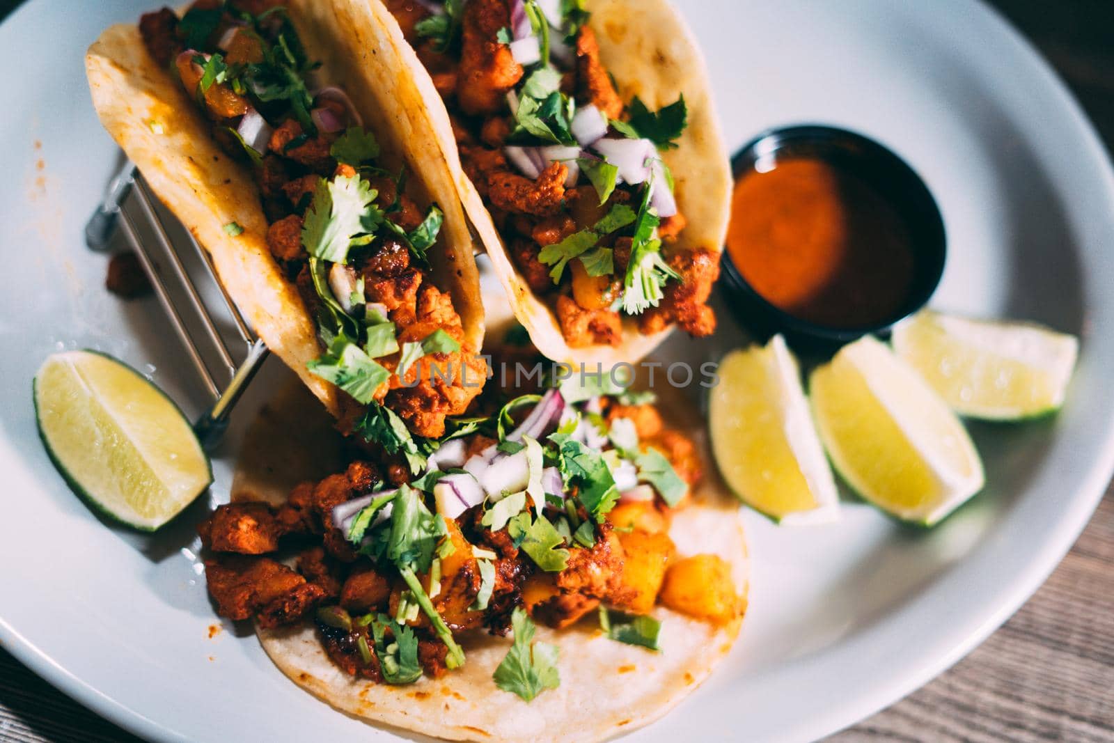 A plate of tacos and tortilla snacks