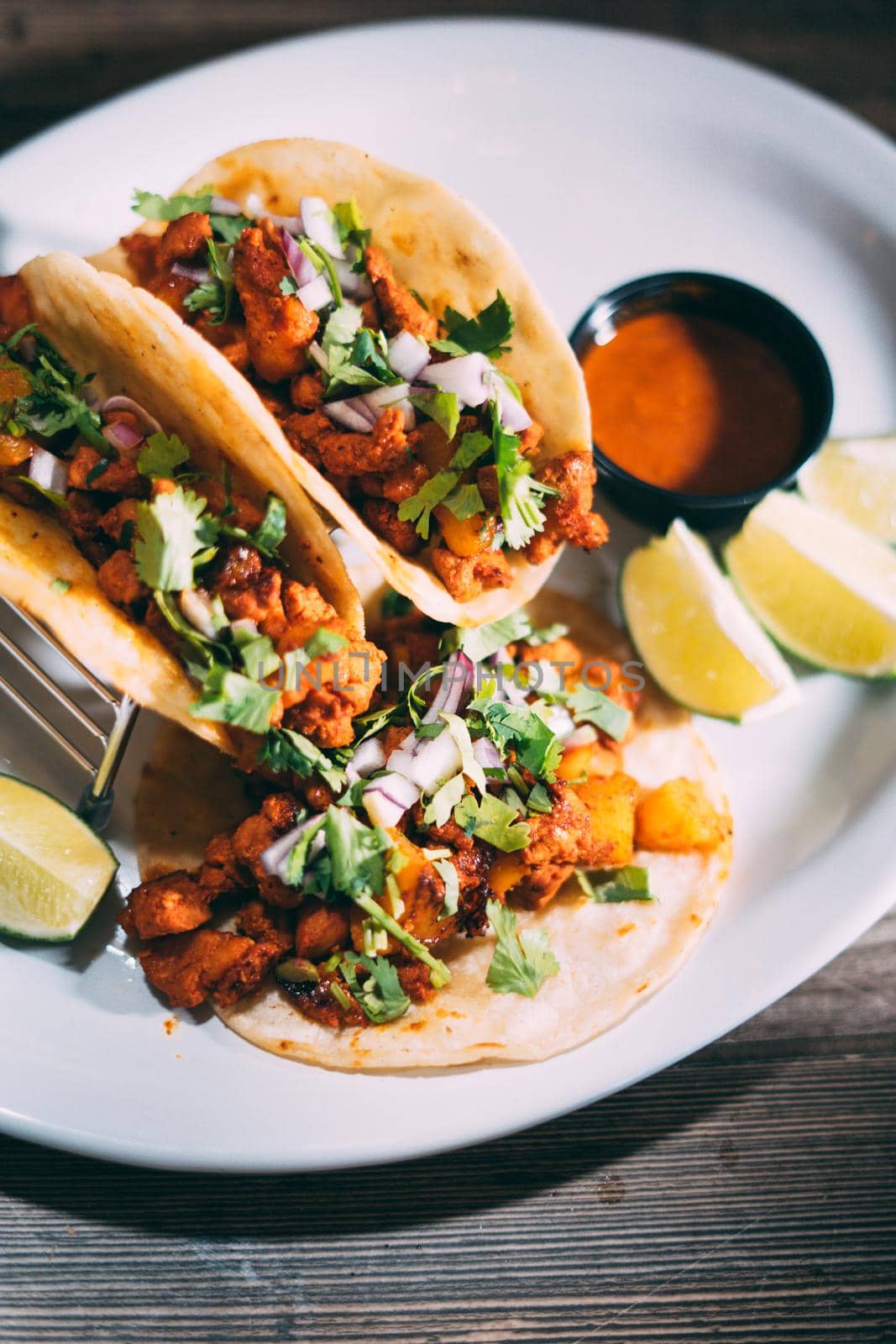 A plate of tacos and tortilla snacks