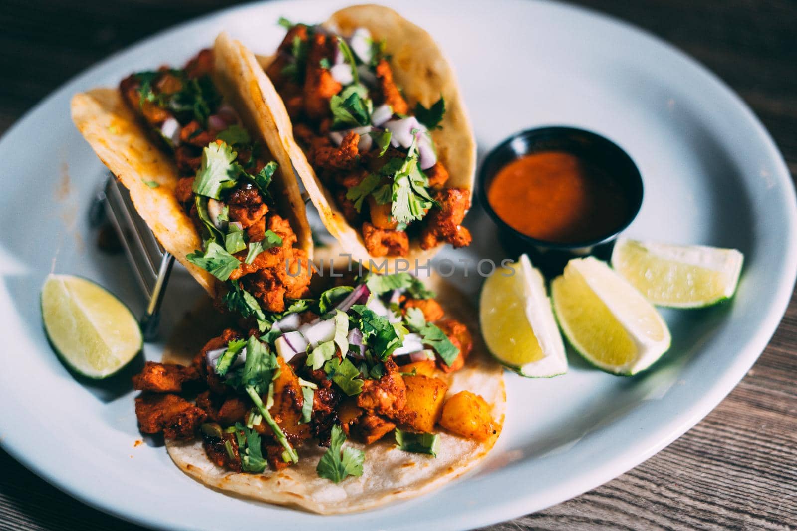 A plate of tacos and tortilla snacks