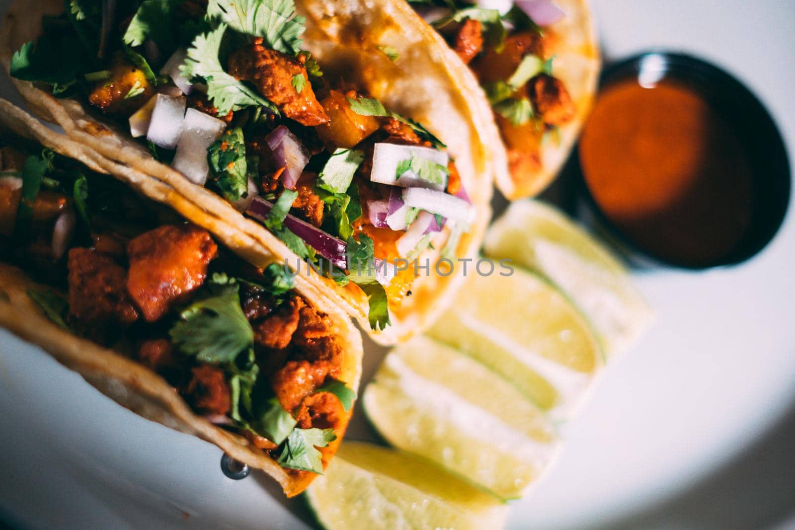 A plate of tacos and tortilla snacks