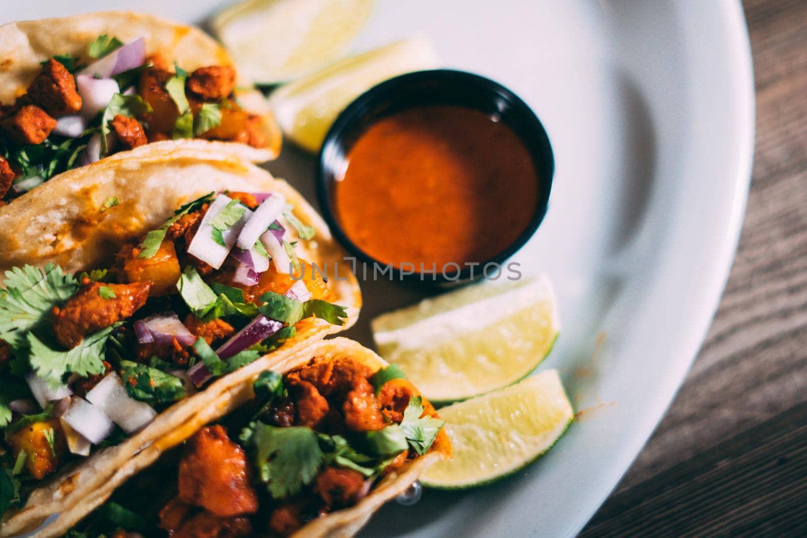 A plate of tacos and tortilla snacks