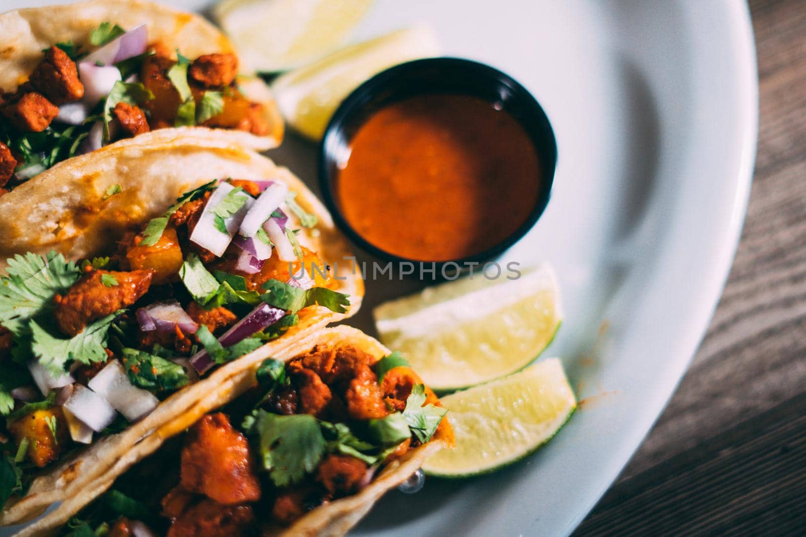 A plate of tacos and tortilla snacks