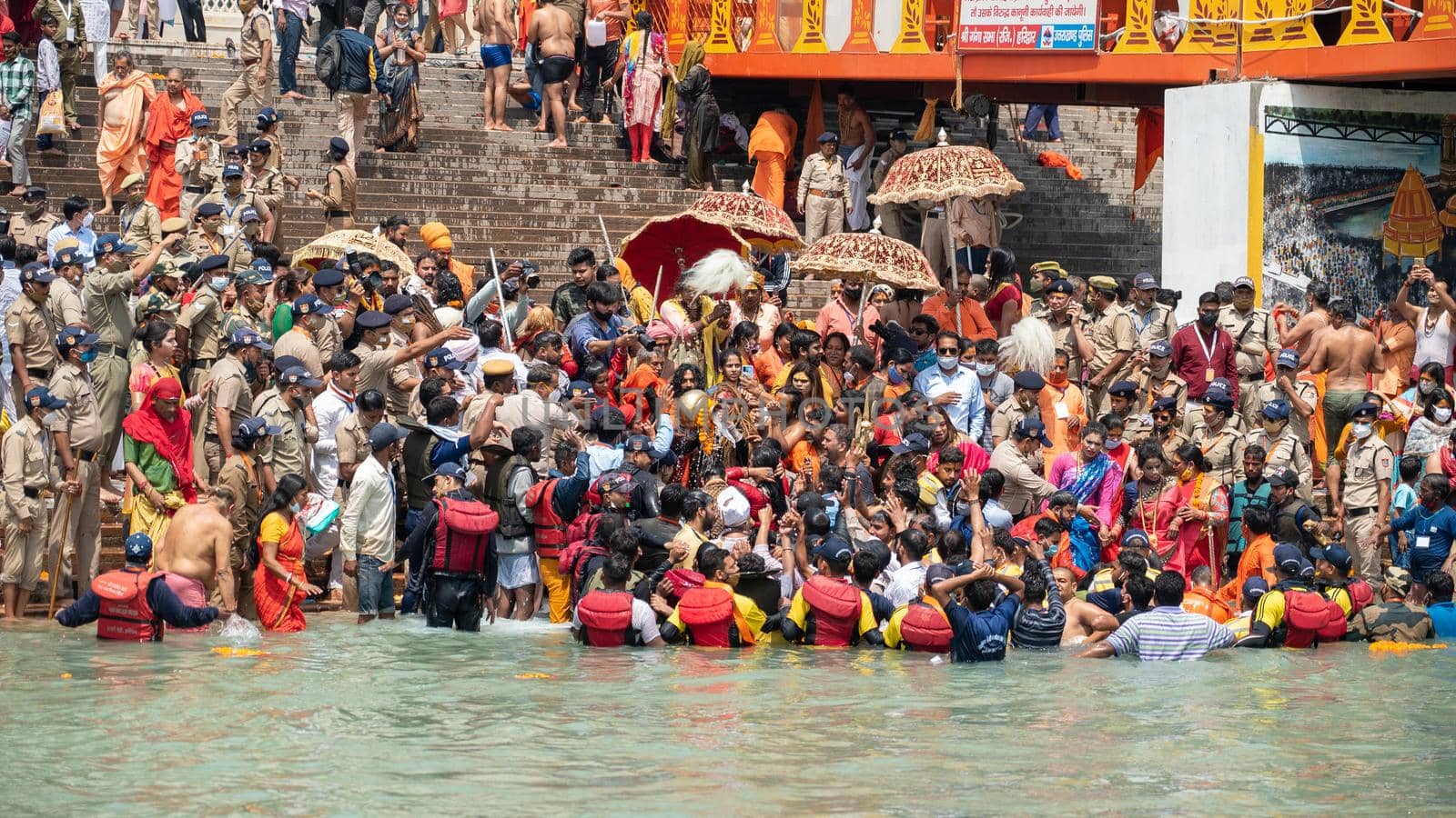 Haridwar, Uttarakhand India April 06, 2021. A Dip of Spirituality and faith, Maha Kumbh 2021. Morning Time dip, Indian saints batting in Ganges of Ganga River and Worshipping their God. High-quality