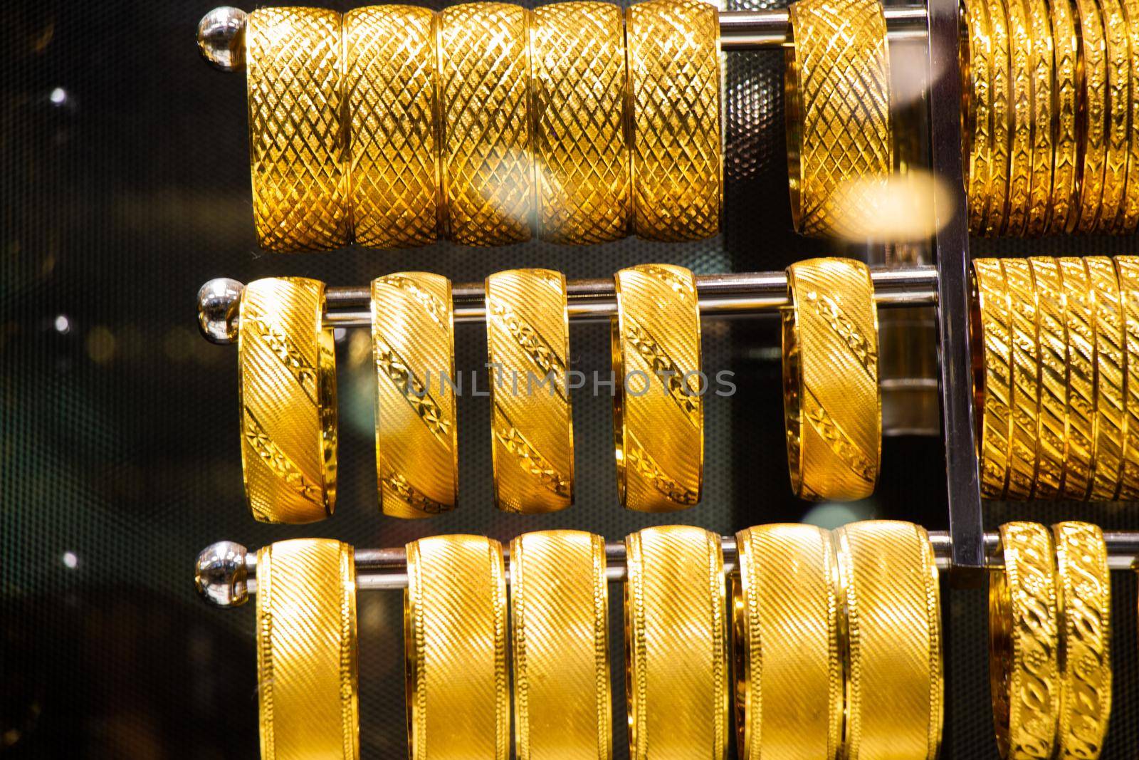 Display of dozens of golden bracelets in Turkish style by berkay