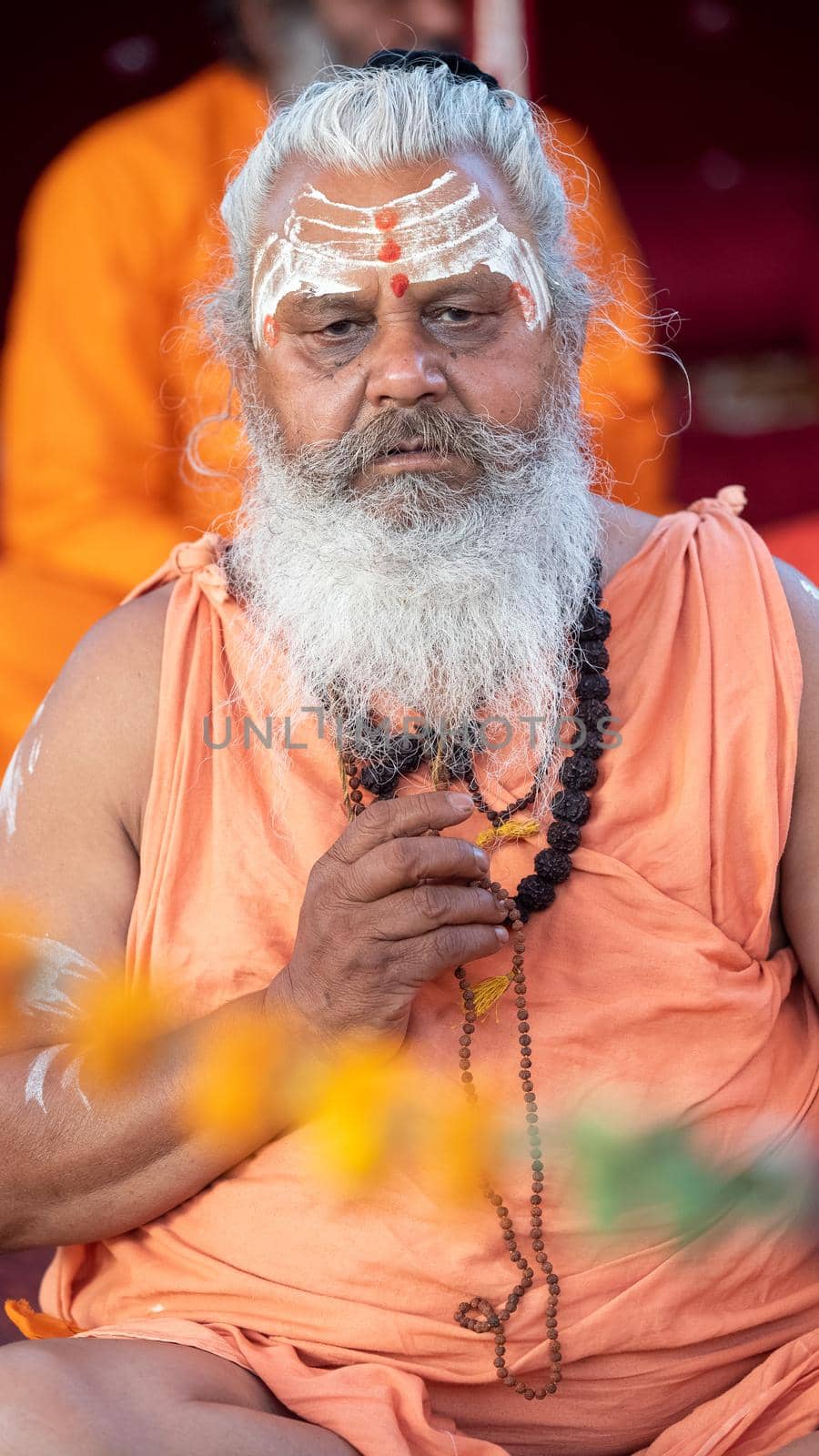 Haridwar, Uttarakhand, India April 12, 2021. Indian Saints in their traditional way of Yog Mudra, meditating. Sitting in silence as part of the initiation of new sadhus during Kumbha Mela. The Naga Sadhus.