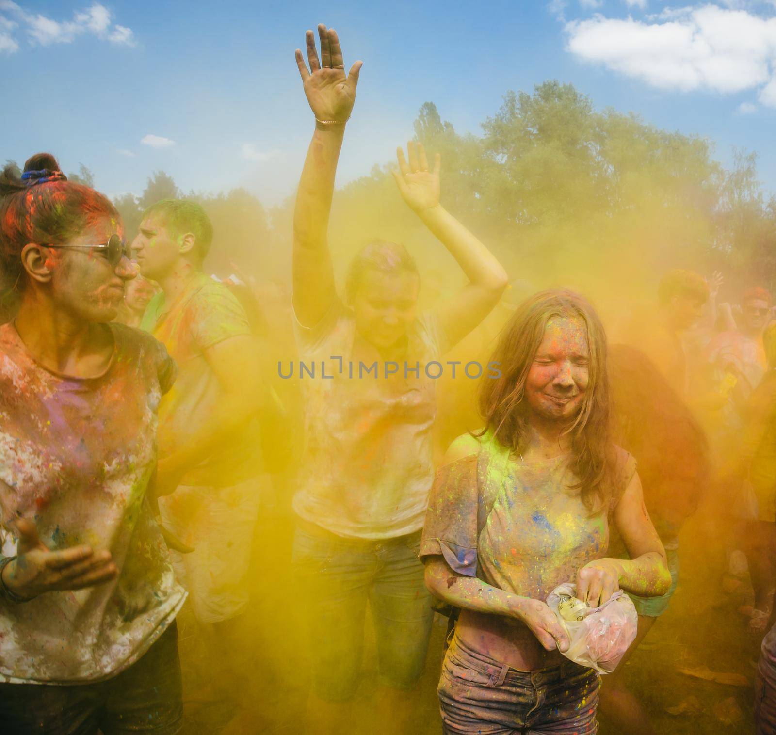 Holi colors holiday. Crazy crowd of young people having fun during festival of colors ColorFest in Kyiv, Ukraine