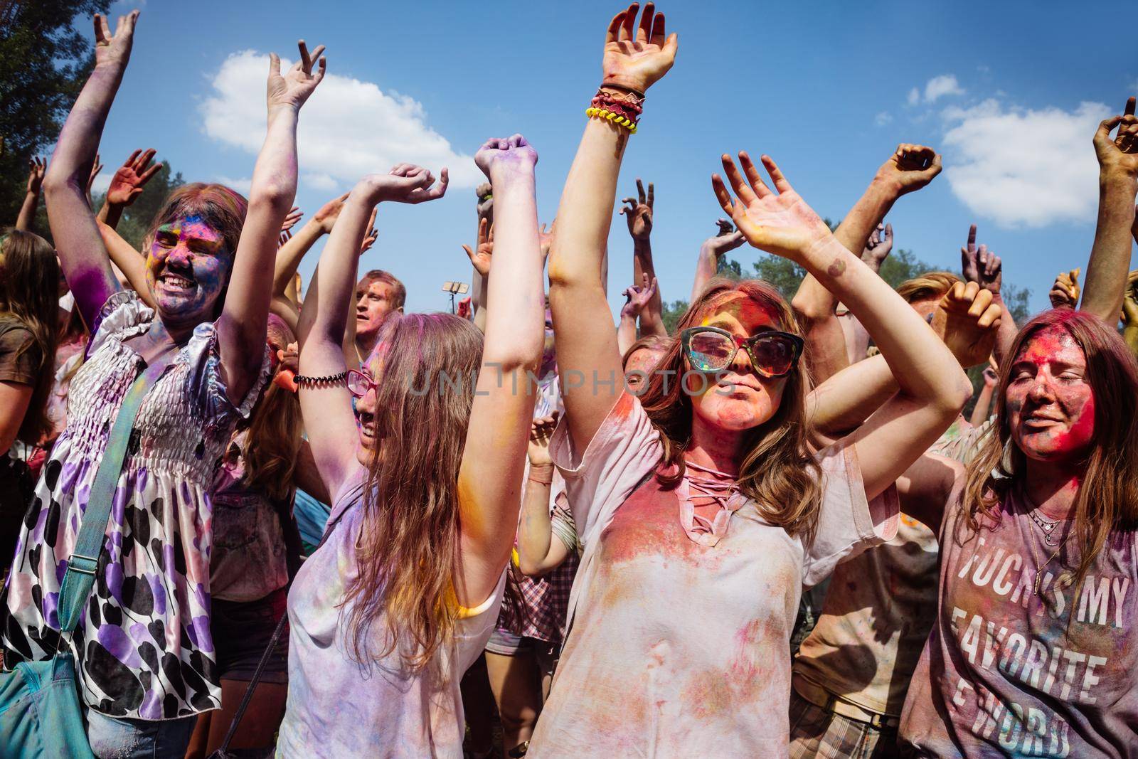 Holi colors holiday. Crazy crowd of young people having fun during festival of colors ColorFest in Kyiv, Ukraine