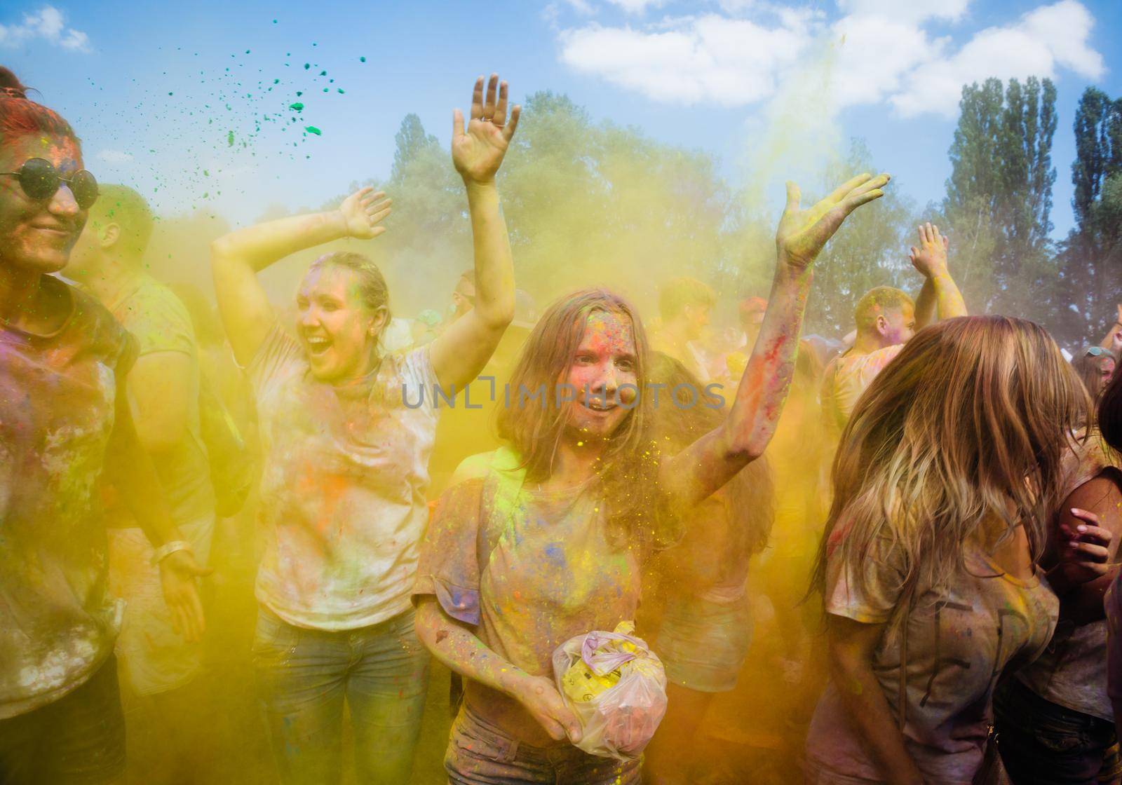 Holi colors holiday. Crazy crowd of young people having fun during festival of colors ColorFest in Kyiv, Ukraine