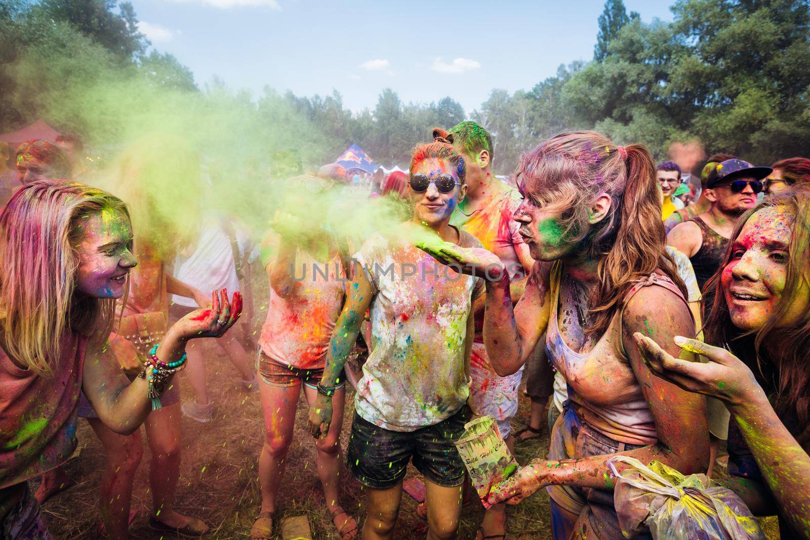 Holi colors holiday. Crazy crowd of young people having fun during festival of colors ColorFest in Kyiv, Ukraine