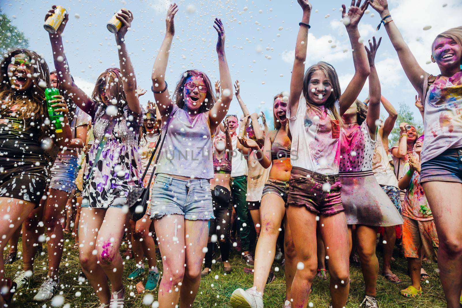 Holi colors holiday. Crazy crowd of young people having fun during festival of colors ColorFest in Kyiv, Ukraine