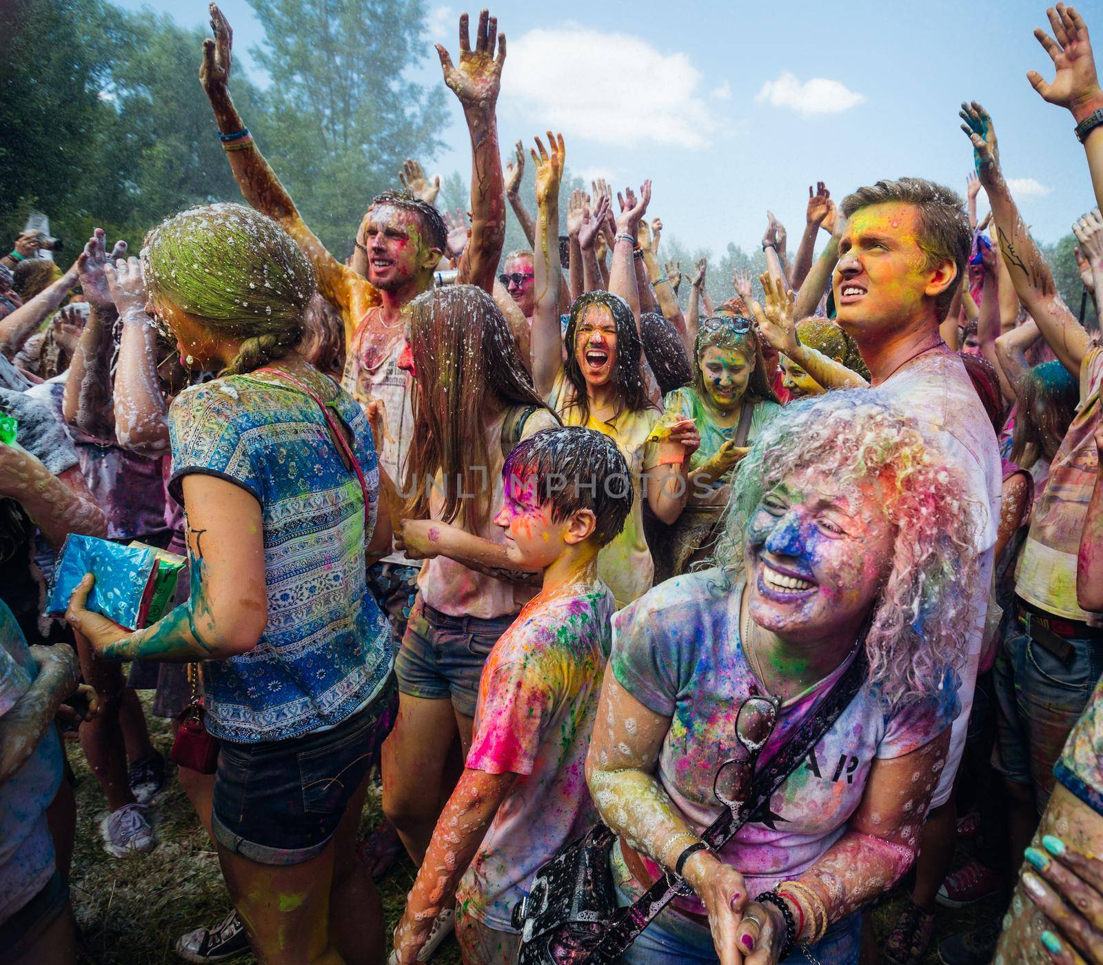 Holi colors holiday. Crazy crowd of young people having fun during festival of colors ColorFest in Kyiv, Ukraine