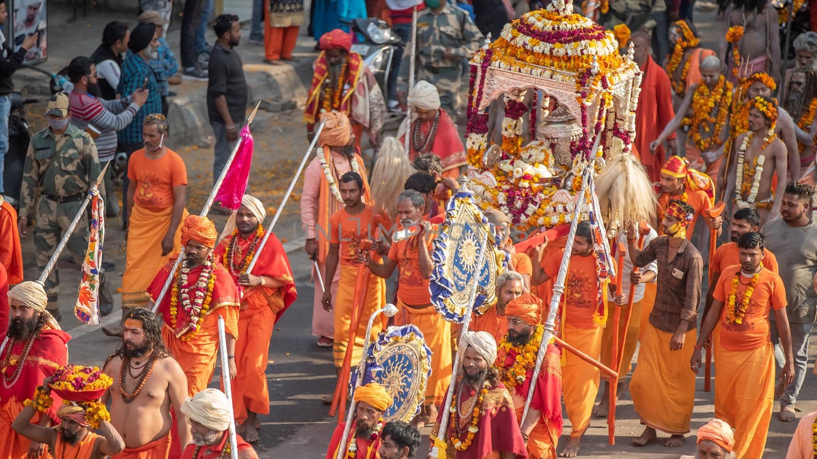 Indian sadhus coming to Kumbh Mela, Royal welcome. Sadhus sitting wearing garland, Appleprores 422 Cinetone. by stocksvids