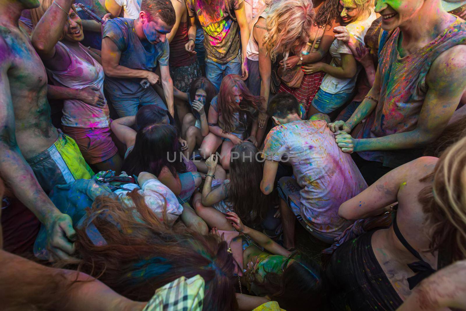 Holi colors holiday. Crazy crowd of young people having fun during festival of colors ColorFest in Kyiv, Ukraine