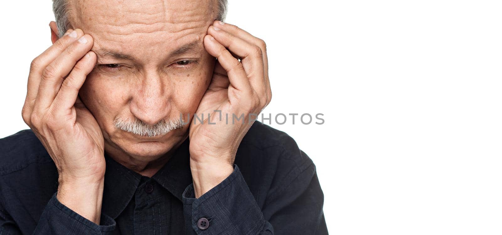 Old man suffering from a headache isolated on white background with copy-space