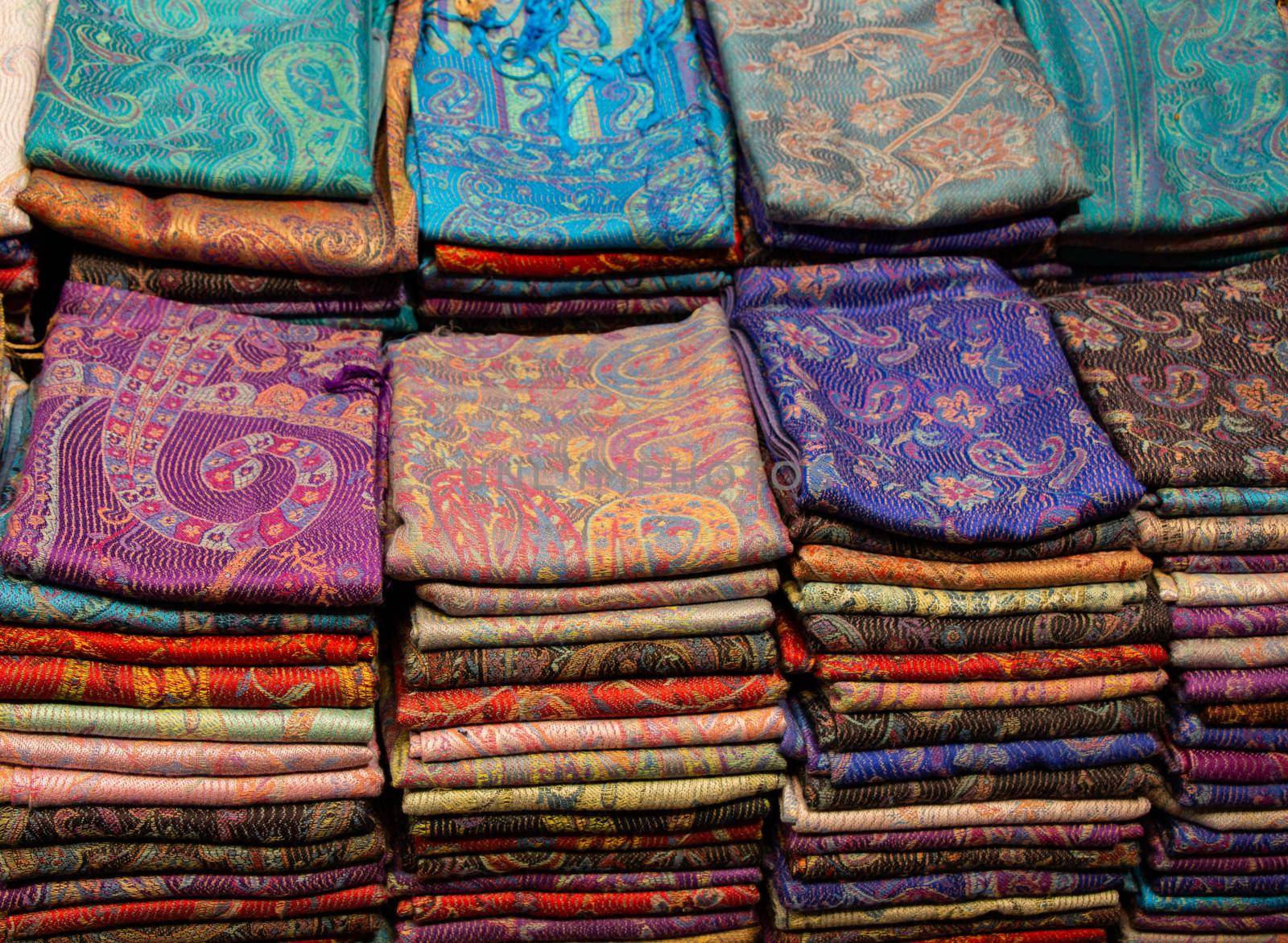 Pile of bright Multi-colored pieces of fabric in a bazaar