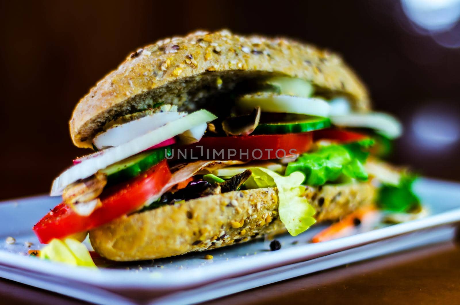 Whole grain sandwich with ham, tomato, mushrooms and egg, fresh organic vegetables by Q77photo