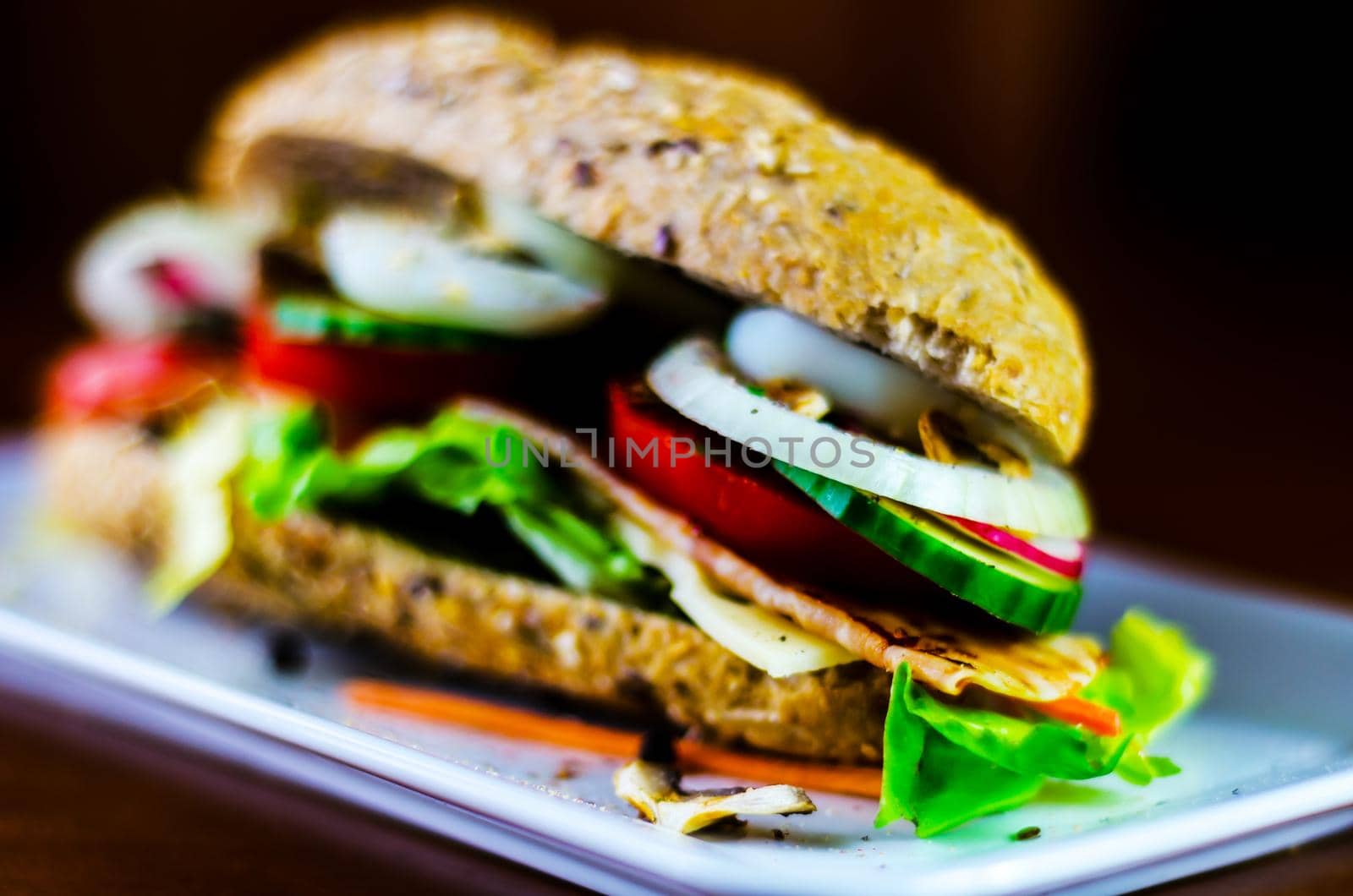 Whole grain sandwich with ham, tomato, mushrooms and egg, fresh organic vegetables, healthy food