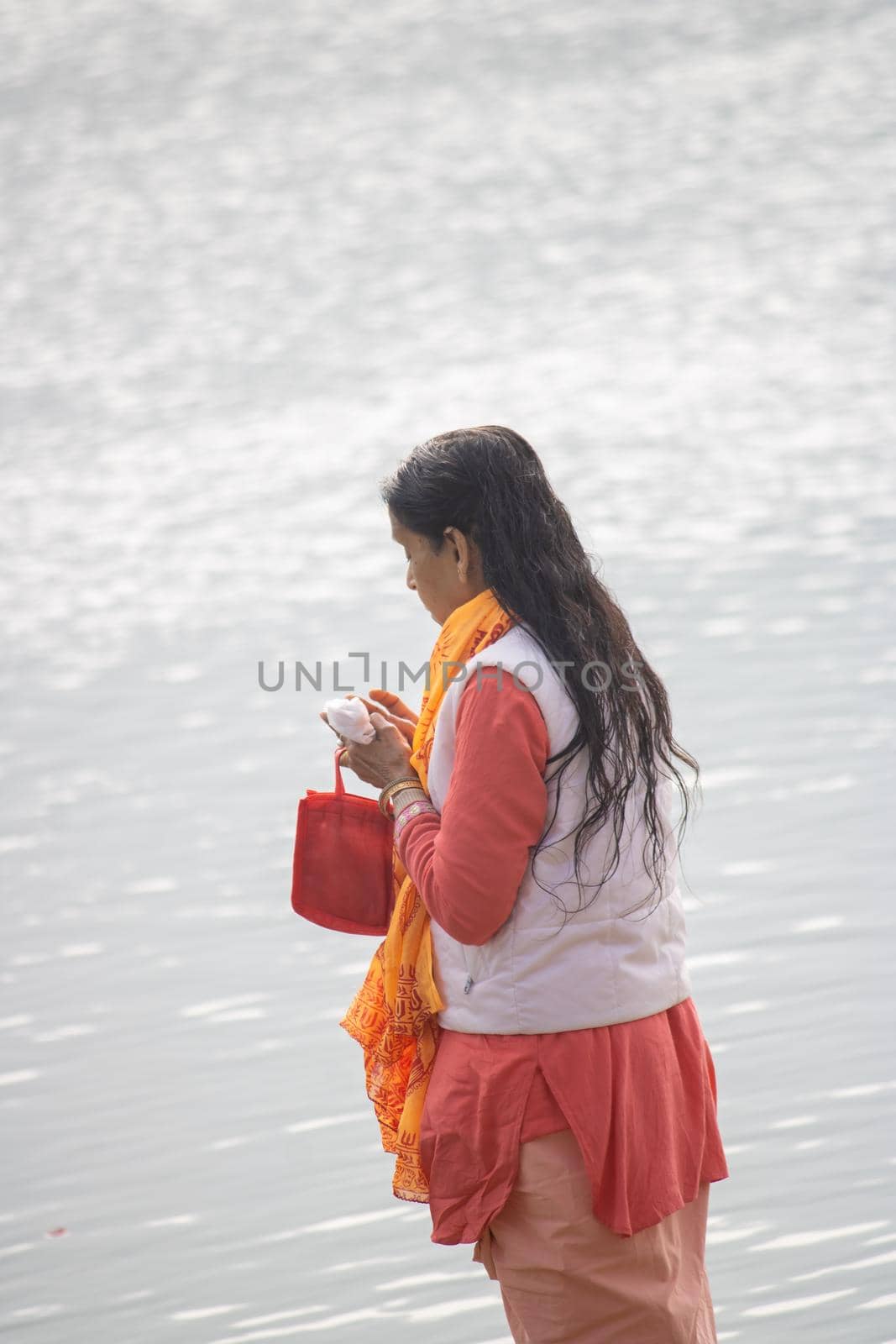 Haridwar, Uttarakhand, India, April 14, 2021.Indian woman worship Holy river the Ganges at Haridwar city of Uttarakahdn India . High quality photo