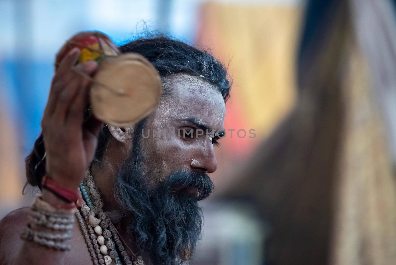 Haridwar, Uttarakhand, India April 12, 2021. Indian Saints in their traditional way of Yog Mudra, meditating. Sitting in silence as part of the initiation of new sadhus during Kumbha Mela. The Naga Sadhus.