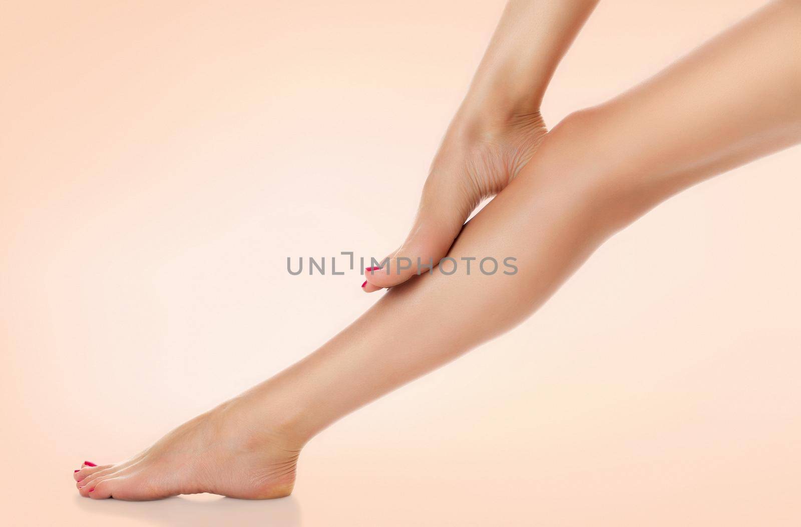 Beautiful female legs. Skin care concept by Nobilior