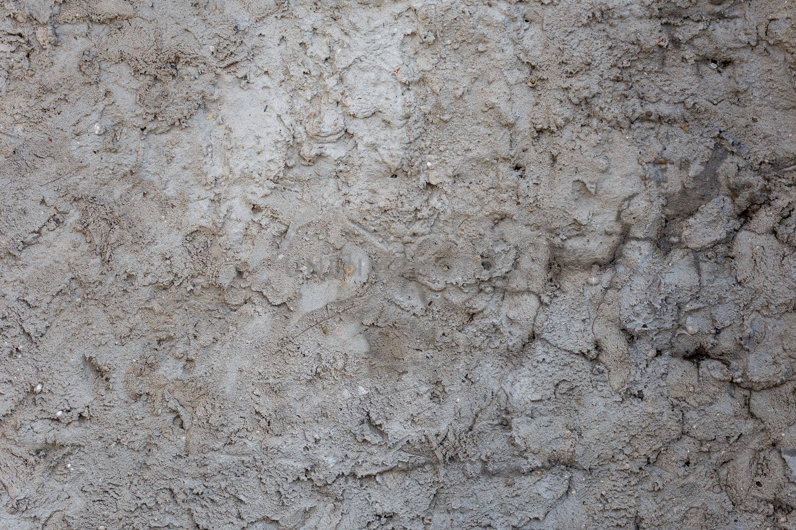 rough and bumpy cement industrial wall - flat texture and background.