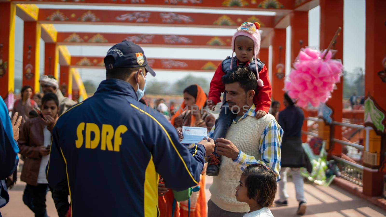 Policemen spreading awareness of protection from Coronavirus to stay safe from Coronavirus during Maha Kumbh 2021 by stocksvids