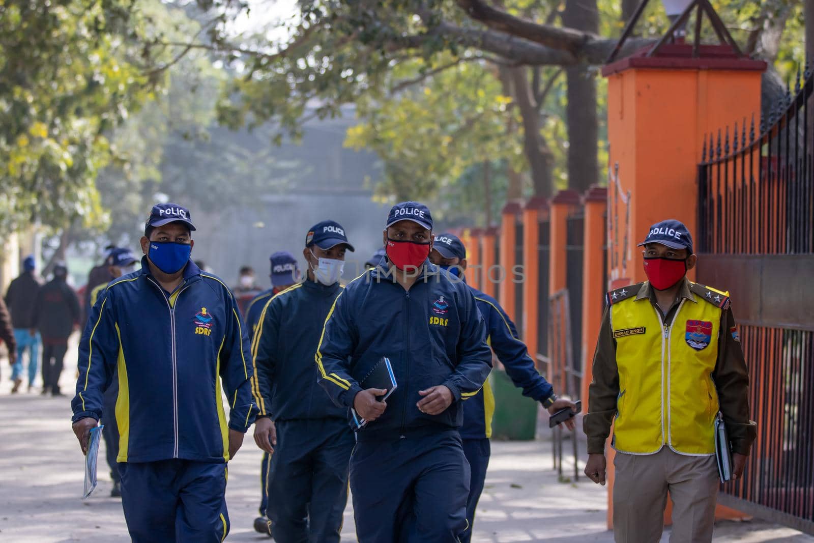 Policemen spreading awareness of protection from Coronavirus to stay safe from Coronavirus during Maha Kumbh 2021 by stocksvids