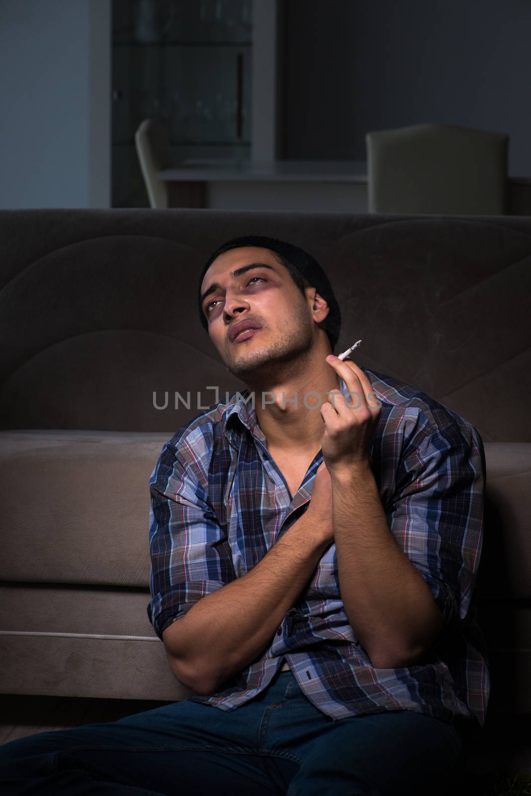 Young man in agony having problems with narcotics 