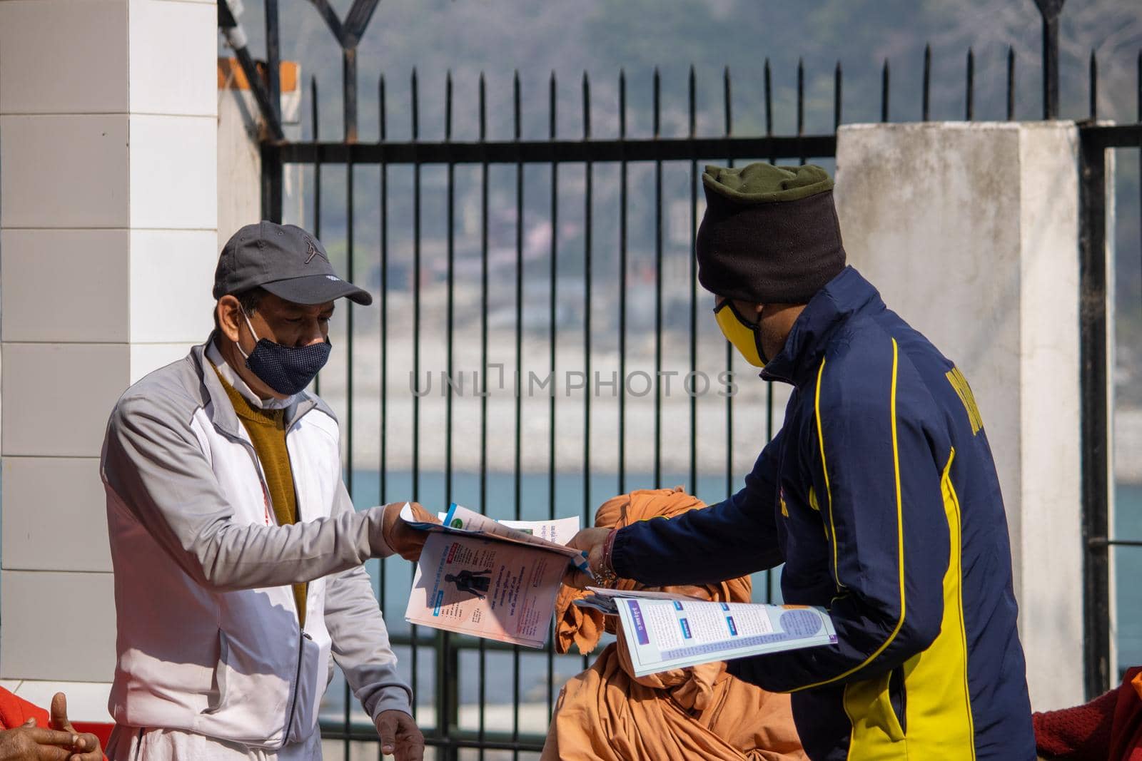 Policemen spreading awareness of protection from Coronavirus to stay safe from Coronavirus during Maha Kumbh 2021 by stocksvids