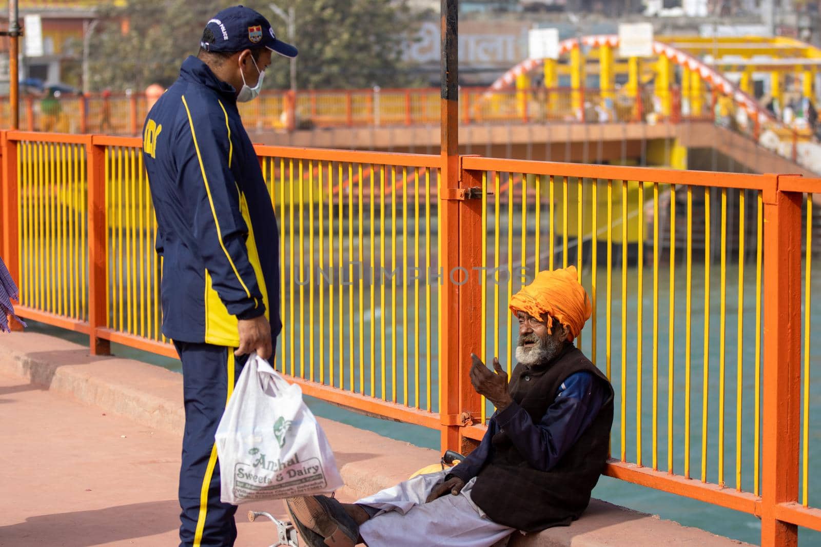 Policemen spreading awareness of protection from Coronavirus to stay safe from Coronavirus during Maha Kumbh 2021 by stocksvids