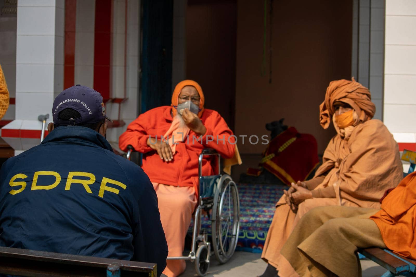 Policemen spreading awareness of protection from Coronavirus to stay safe from Coronavirus during Maha Kumbh 2021 by stocksvids